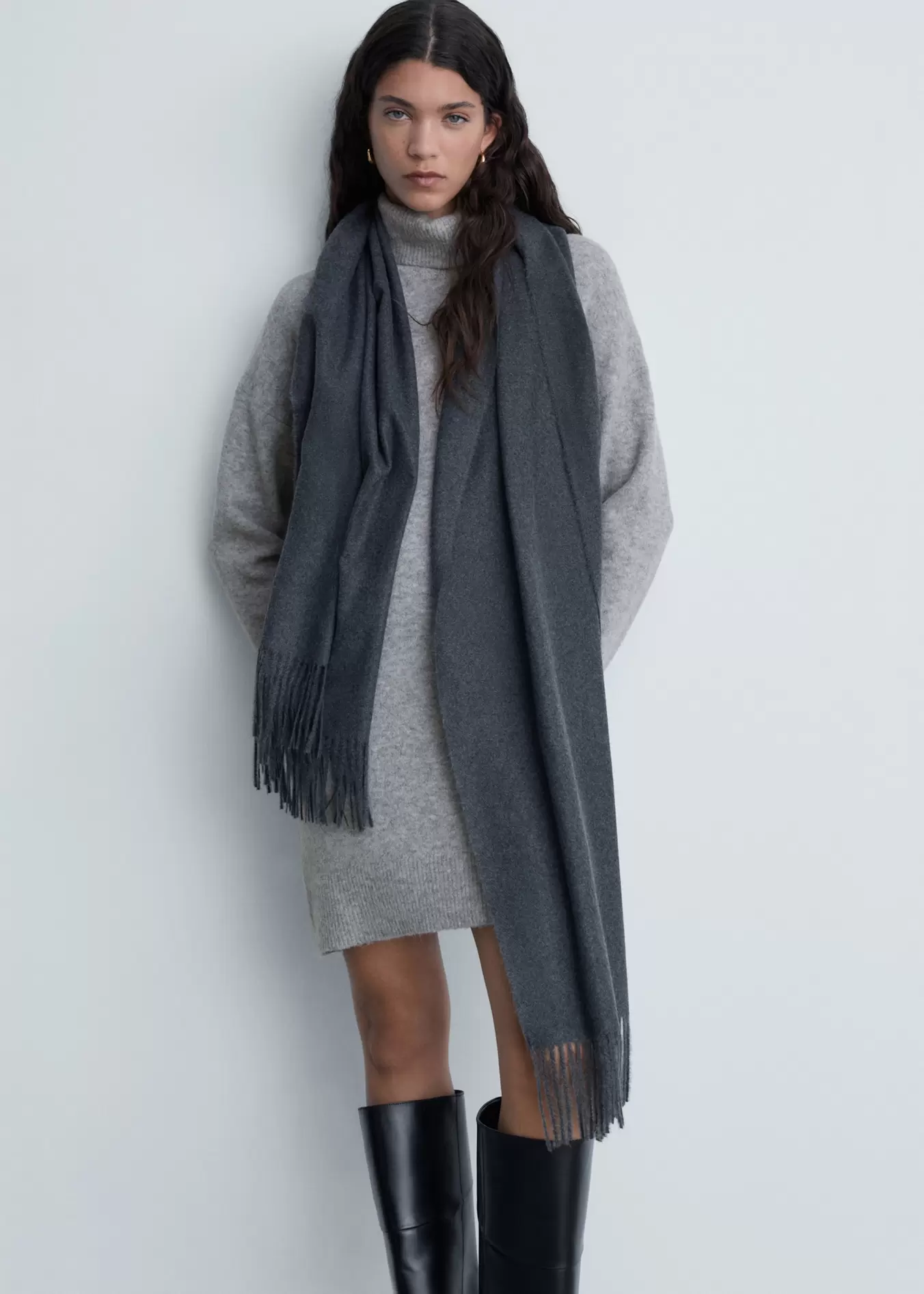 Short knitted turtleneck dress offers at $39.99 in Mango